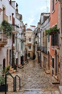 Narrow street amidst buildings in town