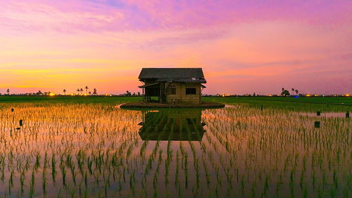 Scenic view of lake against sky during sunset