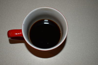 High angle view of black coffee on table