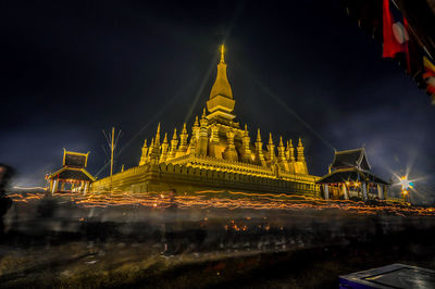 Illuminated buildings in city at night