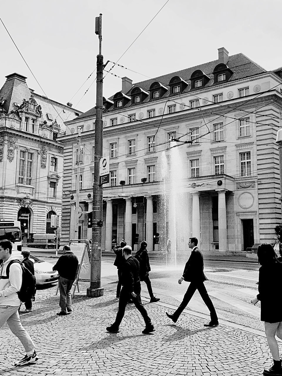 PEOPLE WALKING ON STREET IN CITY