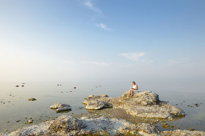 Woman reading at sea