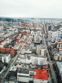 High angle view of buildings in city against sky