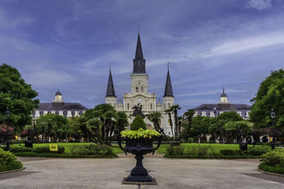 View of buildings against cloudy sky