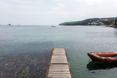 Pier over sea against sky