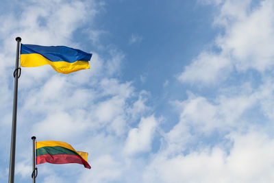 Low angle view of flag against sky