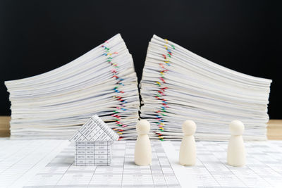 Close-up of books on table against black background