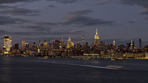 Illuminated buildings in city at night