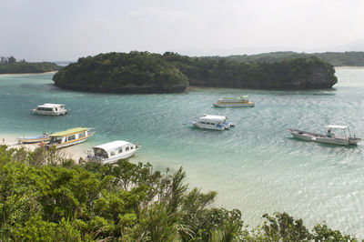 High angle view of boats sailing in sea against sky