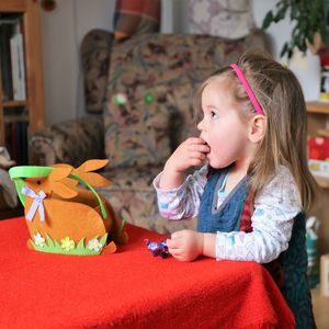 Cute girl sitting on table