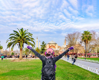 Rear view of woman standing against hagia sophia museum