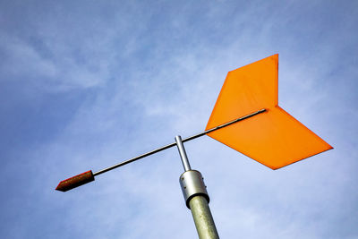 Low angle view of street light against sky