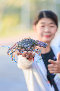 Portrait of woman holding fish