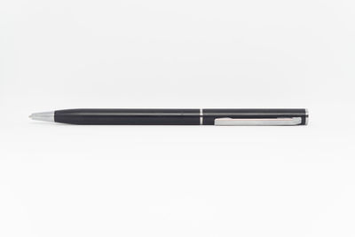 High angle view of pen on table against white background