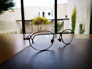 Close-up of eyeglasses on table