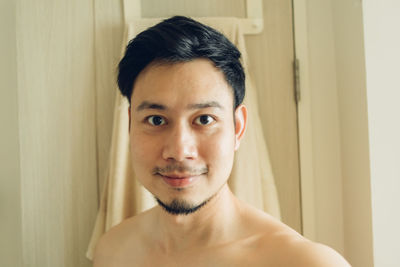 Portrait of man without clothes at home