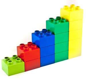 Close-up of colorful toy blocks against white background