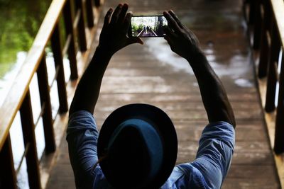 Man photographing his friends with a smart phone