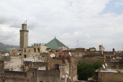 Buildings in city against sky