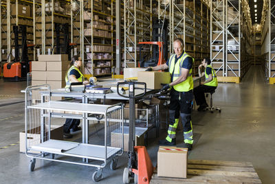 Multi-ethnic coworkers working at distribution warehouse