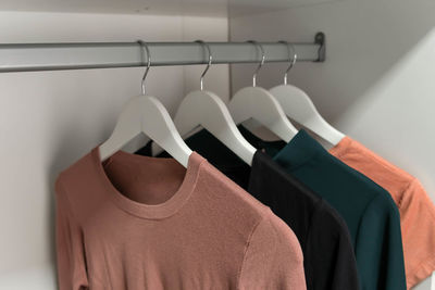 Fashionable clothes on a wardrobe rack. hangers with clothes.