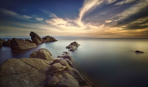 Scenic view of sea against sky during sunset