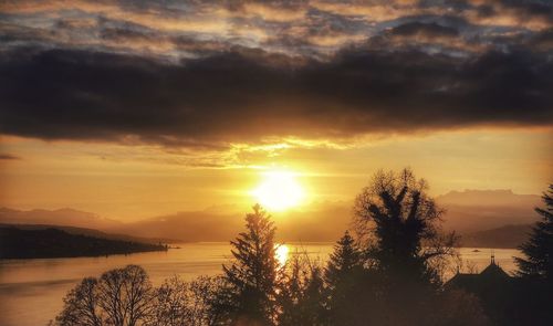 Scenic view of lake against sky during sunset