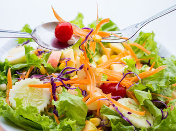 Close-up of chopped fruits in plate