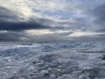 Scenic view of sea against sky during winter