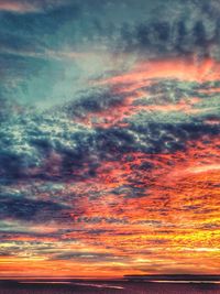 Scenic view of cloudy sky at sunset