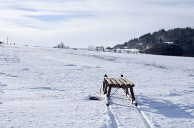 Scenic view of landscape against sky during winter