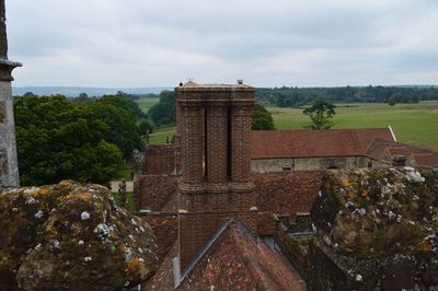 Built structure on landscape against sky