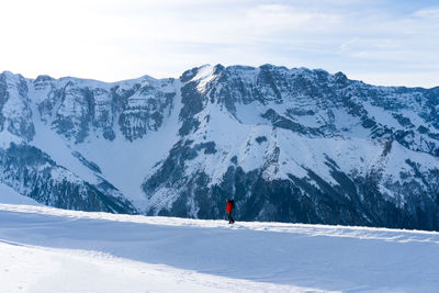 People skiing on snow covered mountain