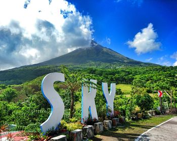 Scenic view of landscape against cloudy sky