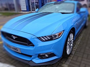 Close-up of blue car