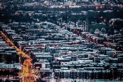 Aerial view of illuminated cityscape at night