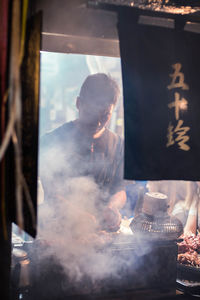 Man working at market stall