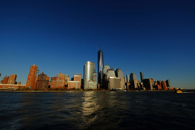 Sea with buildings in background