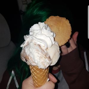 Close-up of hand holding ice cream cone