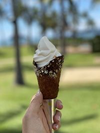 Midsection of person holding ice cream