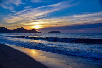 Sunrise over the headland east of vila baleira, porto santo island, madeira, portugal