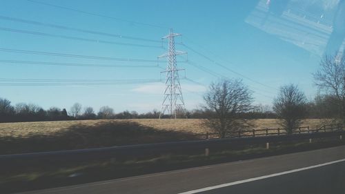 Electricity pylon on field