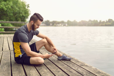 Woman sitting on a lake