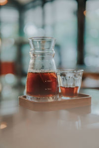 Close-up of coffee in glass on table