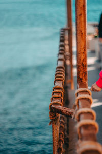 Close-up of rope tied on railing