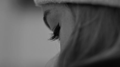 Close-up of woman wearing eyeliner