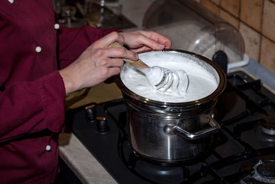 Egg whites with sugar are whipped with a metal whisk to obtain an air meringue