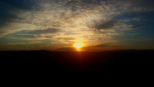 Scenic view of dramatic sky during sunset