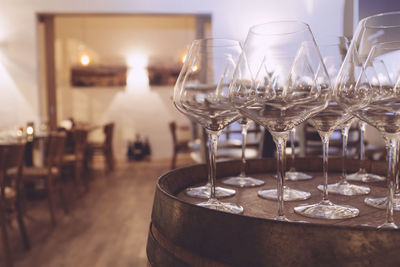 Empty wineglass on barrel in restaurant