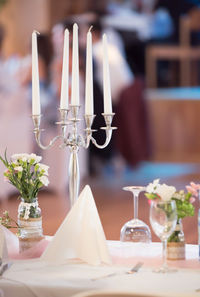 Close-up of flower vase on table in restaurant